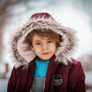 a boy wearing a furry hat